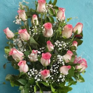 One-sided arrangement of 20 pink roses in a ceramic vase, ideal for gifting and flower delivery in Delhi.