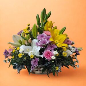 Bright, colorful flower arrangement in a basket